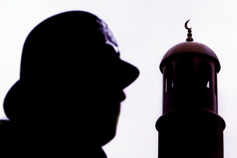 A police officer stands guard outside Finsbury Park mosque following a raid in north London, January 20, 2003