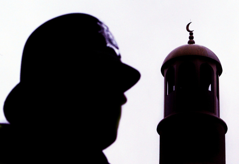 A police officer stands guard outside Finsbury Park mosque following a raid in north London, January 20, 2003