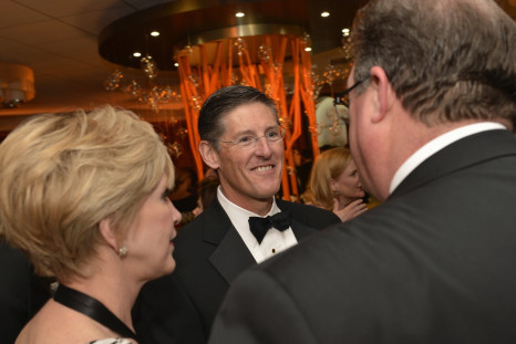Citigroup CEO Michael Corbat (C) chats with Thomson Reuters CEO Jim Smith and his wife Pam Kushmerick