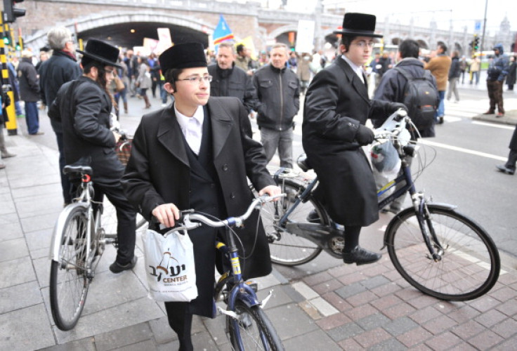 Three Orthodox Jews on their bicycle