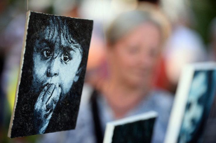 Painting of a Roma baby is on display at the open-air exhibition in Nehru Park in Budapest