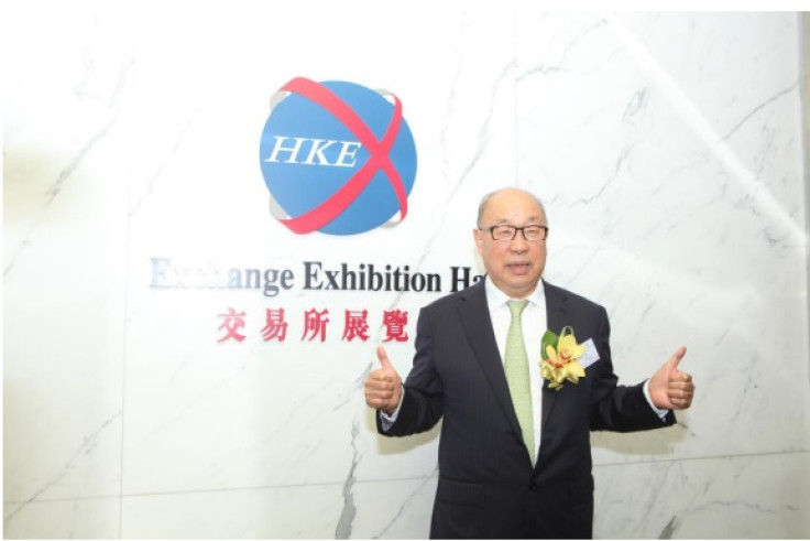 Wan Long, Chairman and Chief Executive Officer of WH Group, photographed at the  Stock Exchange of Hong Kong, toasting to the success of stock prices on the first trading day.