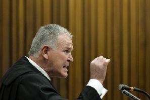 Barry Roux likened Oscar Pistorius to a abused woman when he shot Reeva Steenkamp
