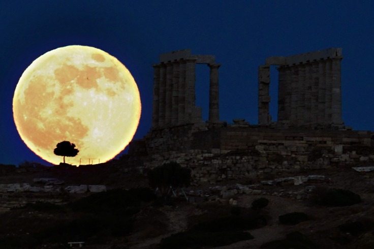 supermoon next to Greek temple