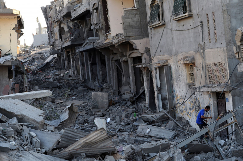A Palestinian man enters his partialy destroyed home in the devastated neighbourhood of Shejaiya in Gaza City (Getty)