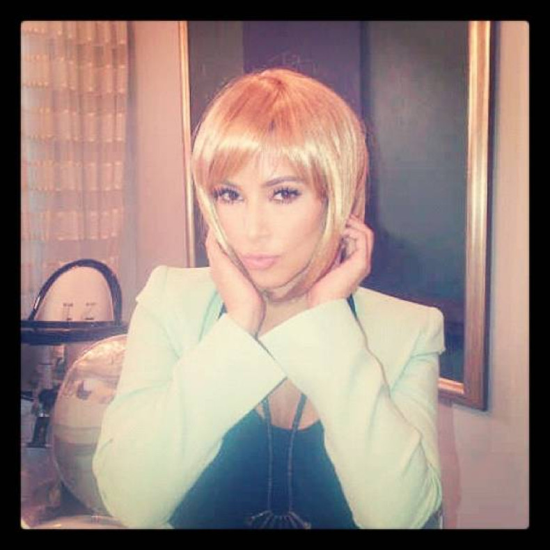Kim Kardashian in blonde wig.