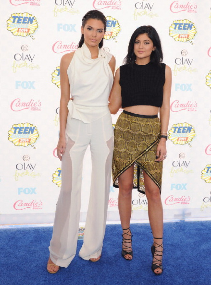 Kendall Jenner and sister Kylie Jenner arrive at the 2014 Teen Choice Awards at The Shrine Auditorium on August 10, 2014 in Los Angeles, California.