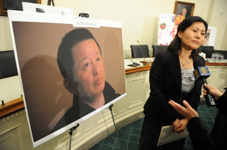 Geng He with a picture of her jailed husband dissident lawyer Gao Zhisheng in 2011, (Getty Tim Sloan)