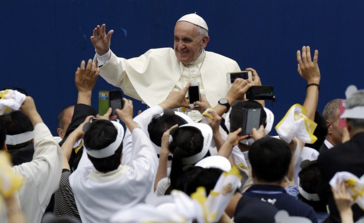 Pope Francis is greeted by the faithful upon his arrival for the Holy Mass at Daejeon World Cup stadium in Daejeon Pope Francis is greeted by the faithful upon his arrival for the Holy Mass at Daejeon World Cup stadium in Daejeon
