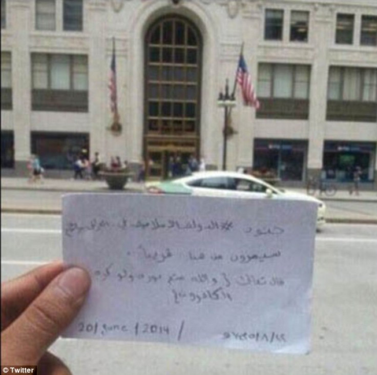 Tweet showing message held up in front of Chicago's Old Republic building. 'Soldiers of the Islamic State of Iraq and Syria will pass from here soon' it reads. (Twitter)
