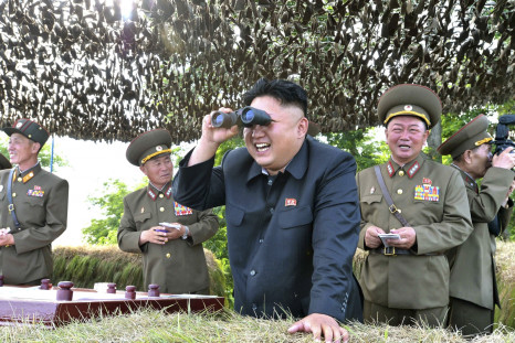 Kim Jong Un looks through binoculars