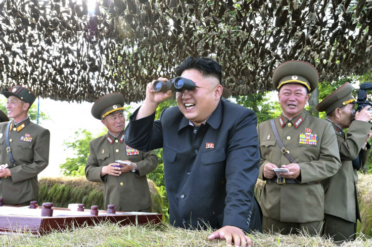Kim Jong Un looks through binoculars