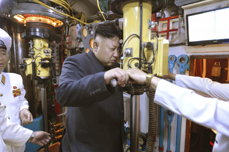 Kim Jong Un looks through a submarine periscope