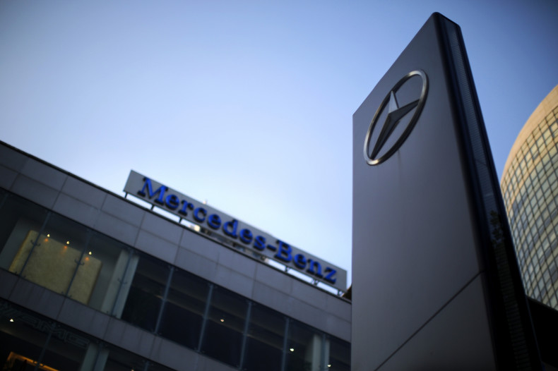 A Mercedes-Benz logo and sign are seen at a dealership in downtown Shanghai