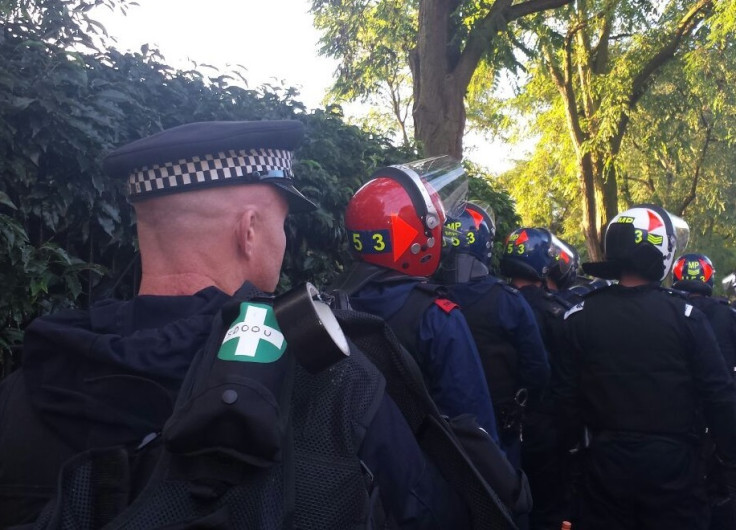 Police prepare to enter a home in raids targeting potential Notting Hill Carnival troublemakers