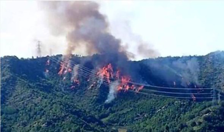 A forest fire rages after two Italian Tornado jets crashed into the hills.