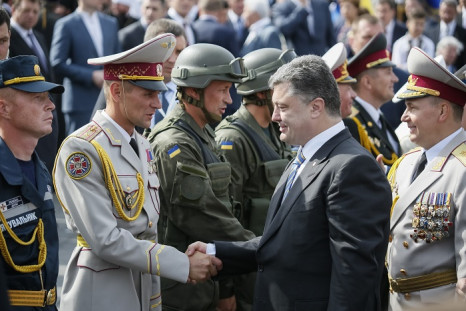 Ukraine's President Petro Poroshenko greets servicemen who participated in Ukraine's Independence Day military parade in the centre of Kiev.