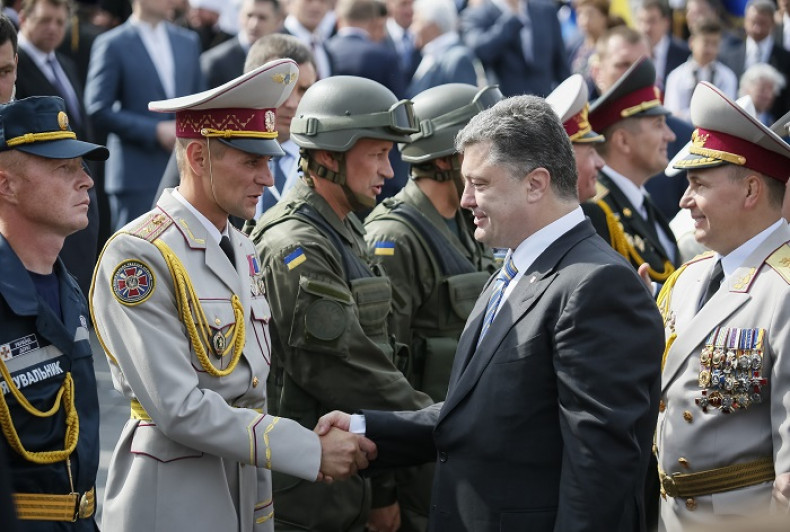 Ukraine's President Petro Poroshenko greets servicemen who participated in Ukraine's Independence Day military parade in the centre of Kiev.