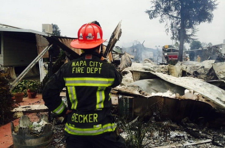 A Napa City firefighter assesses fire damage to homes in the aftermath of the devastating 6.0-magnitude earthquake in Northern California.