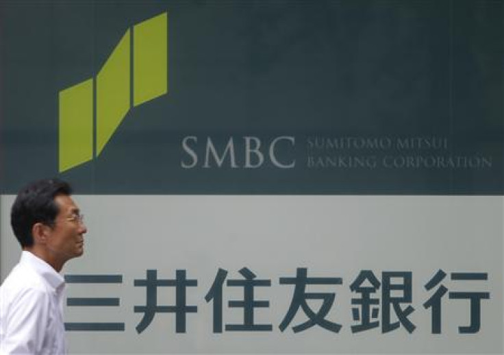 A man walks past a branch of Sumitomo Mitsui Banking Corporation in Tokyo
