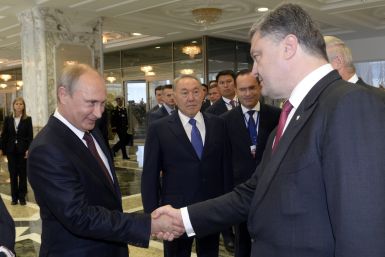 Petro Poroshenko Vladimir Putin shake hands