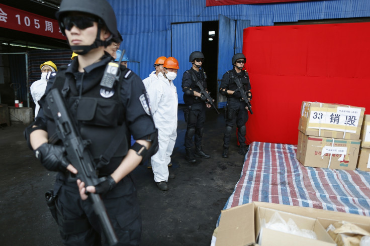 Armed police guard a stash of illegal drug in a case unrelated to trial of Japanese politician Takuma Sakuragi