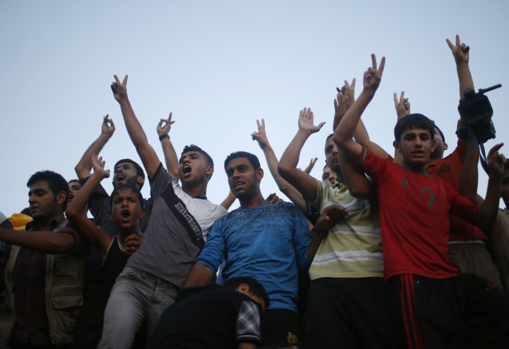 Young men celebrate peace for Gaza in an Israel / Palestine ceasefire