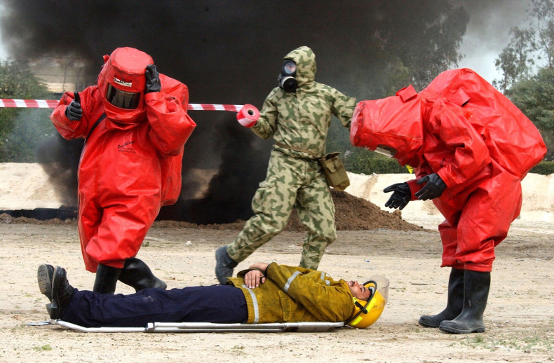 Kuwaiti civil defense forces rehearse contingency plans for a biological weapons attack. (Getty)