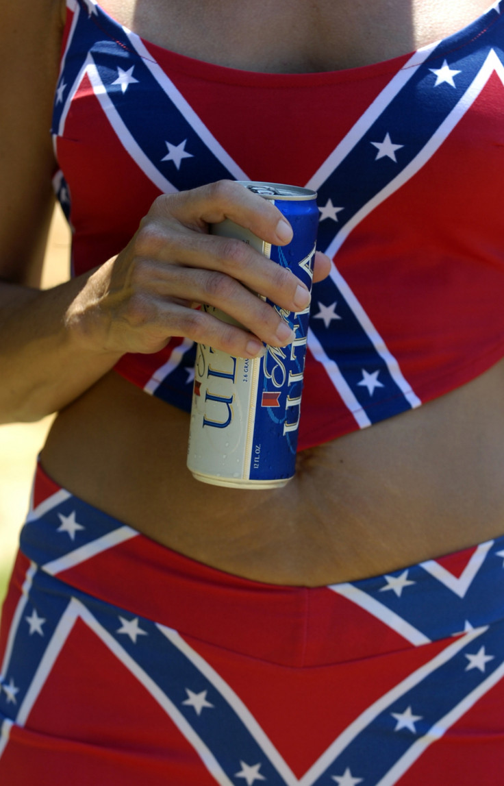 A woman wearing a Confederate flag bikini holds a beer during the annual Redneck Ganmes in Georgia. (Gett/ Stephen Morton))