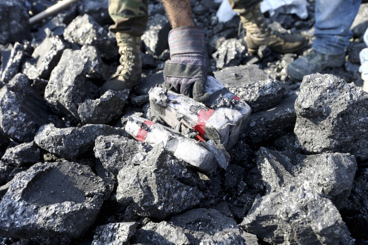 Cocaine seized by police in Huanchaco, Peru. Packets were concealed in hollowed out coal bricks. (Reuters)