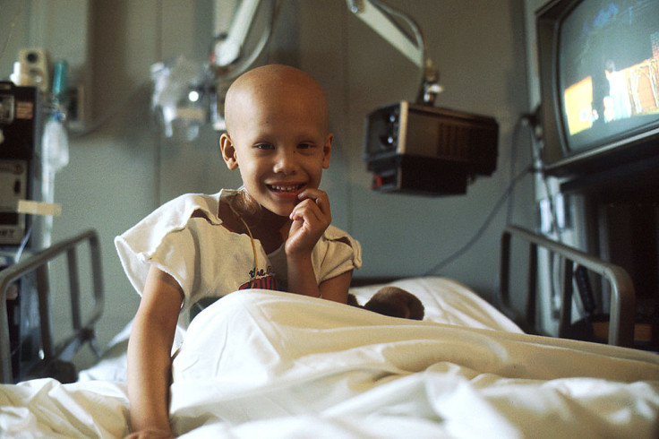 A young child receives chemotherapy