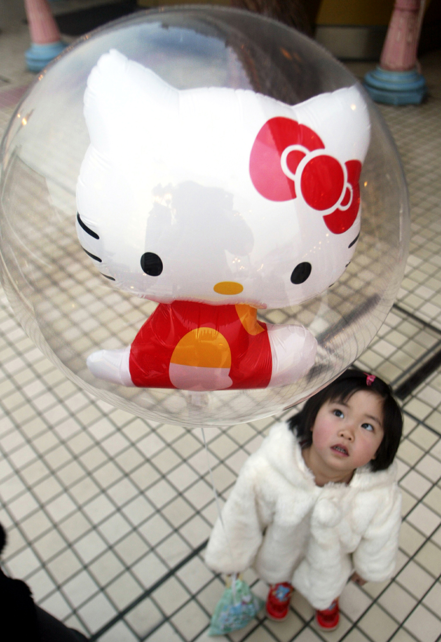 Hello Kitty balloon and child