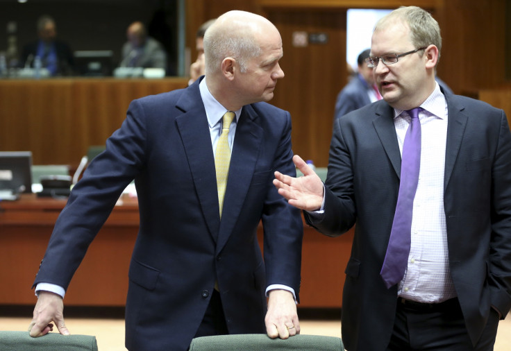 British Foreign Secretary William Hague (L) listens to Estonia's Foreign Minister Urmas Paet
