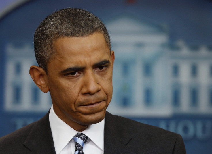 US President Obama pauses during a news conference in the Brady Press Briefing Room at the White House in Washington