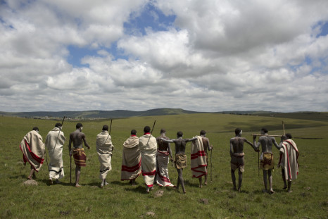 Circumcision initiates pose as they walk on a field in Qunu, in the Eastern Cape