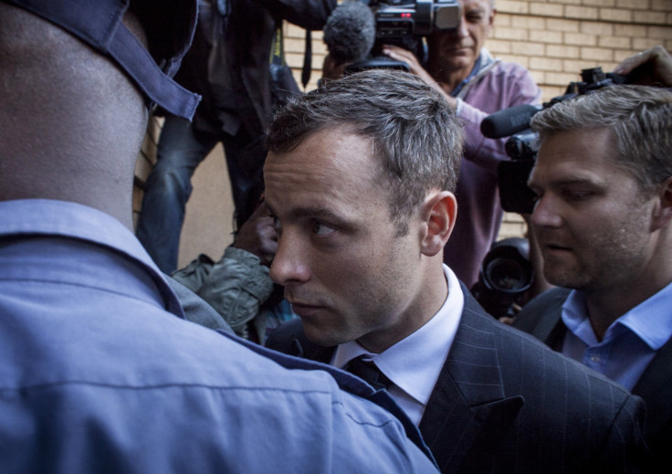 Oscar Pistorius arrives at court for judgement day in his murder trial