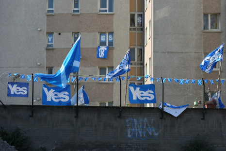'YES' campaign flags fly from a fence near a tower block in Edinburgh September 10, 2014.