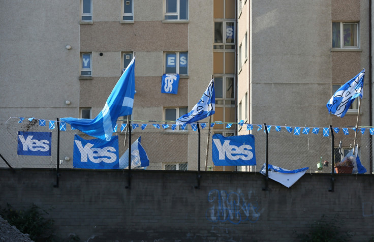 'YES' campaign flags fly from a fence near a tower block in Edinburgh September 10, 2014.