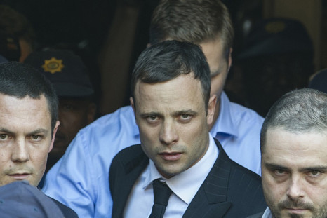 Oscar Pistorius leaves court after day one of the verdict in his trial for killing Reeva Steenkamp
