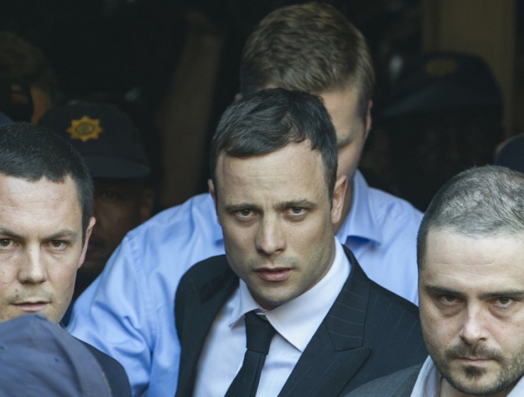 Oscar Pistorius leaves court after day one of the verdict in his trial for killing Reeva Steenkamp