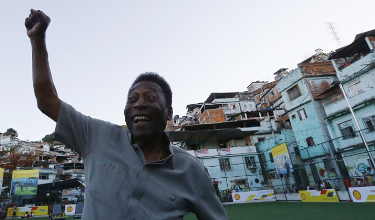 Football legend Pele poses for media at the inauguration of the refurbished energy-saving football pitch at the Morro da Mineira favela in Rio de Janeiro, Brazil.