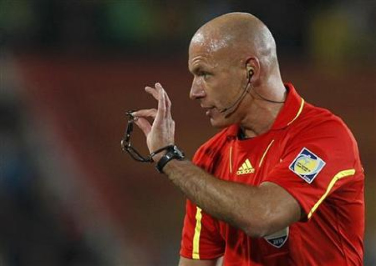Referee Webb holds up his whistle during the 2010 World Cup second round soccer match between Brazil and Chile at Ellis Park stadium in Johannesburg