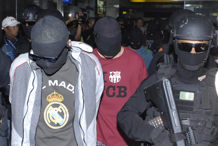 Two of the four suspected Turkish isis militants arrested by Indonesian police shortly after their arrival at Jakarta Airport. (Getty, Bima Sakti)