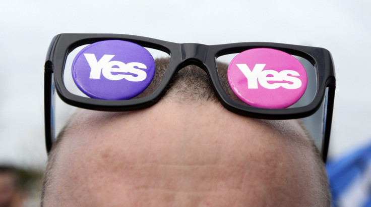 A 'Yes' supporter with 'Yes' spectacles is seen at a rally outside the BBC in Glasgow, Scotland September 14, 2014.