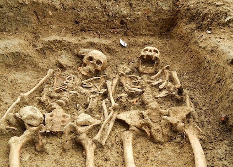 Ancient skeletons unearthed in Leicester with arms entwined after more than 700 years.