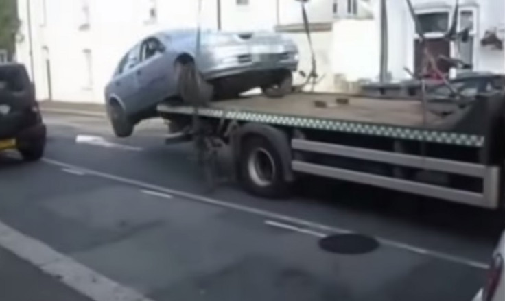 Man drives car off tow truck to escape fine in incident captured on video