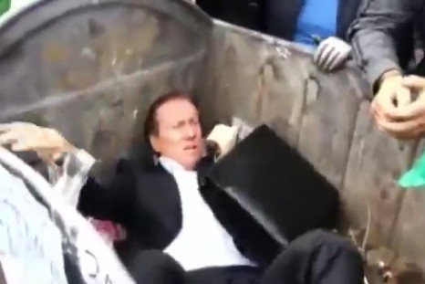 Ukrainian MP Thrown into Rubbish Bin by Angry Mob