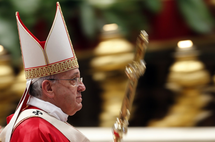 Pope Francis leaves after officiating a mass at the wedding of 20 couples in St.Peter's Basilica at the Vatican,