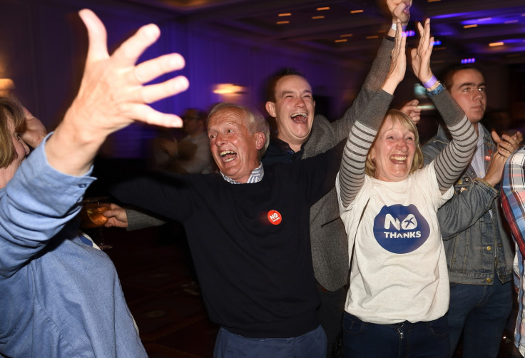 Supporters from the "No" Campaign react to a declaration in their favour, at the Better Together Campaign headquarters in Glasgow, Scotland