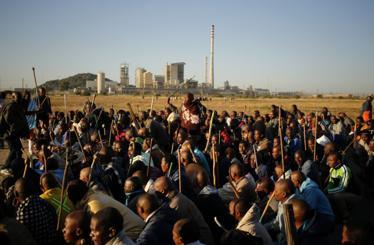 South African miners on strike chant slogans as they march in Nkaneng township outside the Lonmin mine in Rustenburg May 14, 2014